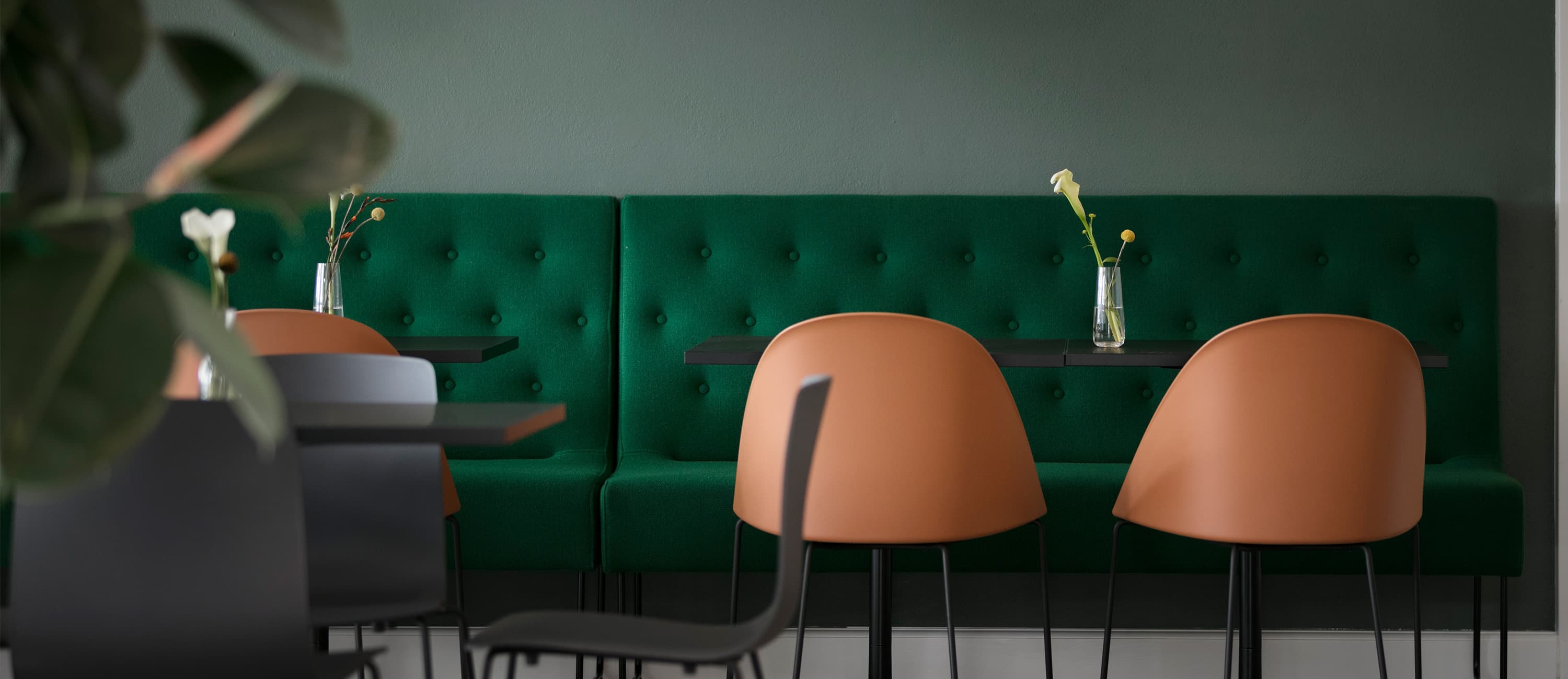 Café with green walls in an office hotel in a listed villa in Copenhagen on the Lakes
