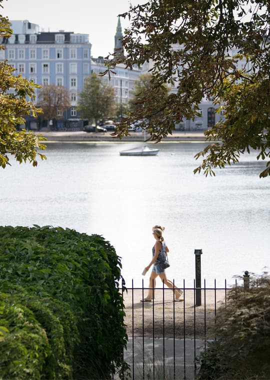 Peblinge Lake and the lakeside promenade by an office hotel on the Lakes in Copenhagen
